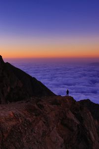 Preview wallpaper mountain, man, loneliness, clouds, al bahah, saudi arabia