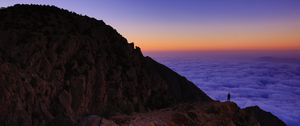 Preview wallpaper mountain, man, loneliness, clouds, al bahah, saudi arabia