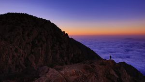 Preview wallpaper mountain, man, loneliness, clouds, al bahah, saudi arabia