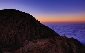 Preview wallpaper mountain, man, loneliness, clouds, al bahah, saudi arabia