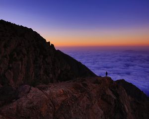 Preview wallpaper mountain, man, loneliness, clouds, al bahah, saudi arabia