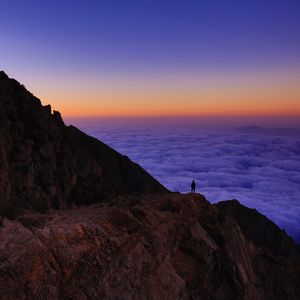 Preview wallpaper mountain, man, loneliness, clouds, al bahah, saudi arabia