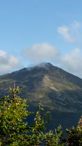 Preview wallpaper mountain, peak, branches, clouds