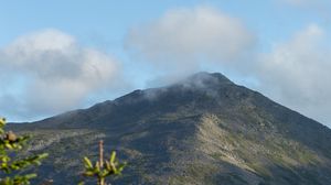 Preview wallpaper mountain, peak, branches, clouds