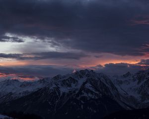 Preview wallpaper mountain, peak, clouds, snowy, sunset, night