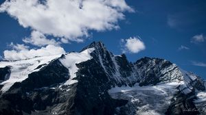 Preview wallpaper mountain, peak, clouds, snow, snowy