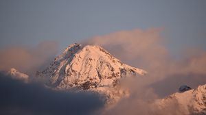 Preview wallpaper mountain, peak, clouds, snow, winter
