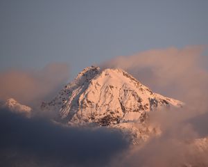 Preview wallpaper mountain, peak, clouds, snow, winter