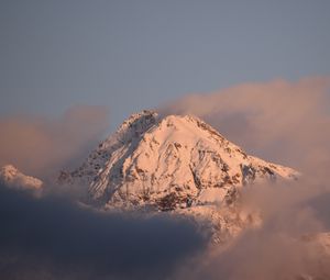 Preview wallpaper mountain, peak, clouds, snow, winter