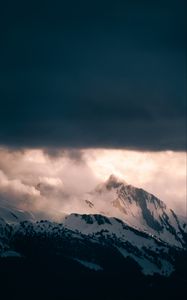 Preview wallpaper mountain, peak, clouds, snow, light, landscape