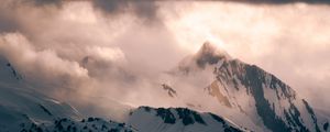 Preview wallpaper mountain, peak, clouds, snow, light, landscape