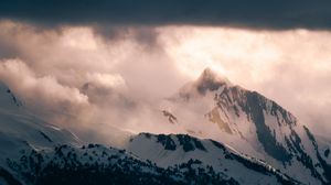Preview wallpaper mountain, peak, clouds, snow, light, landscape