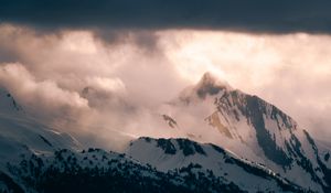 Preview wallpaper mountain, peak, clouds, snow, light, landscape