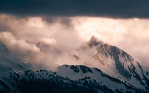 Preview wallpaper mountain, peak, clouds, snow, light, landscape