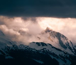 Preview wallpaper mountain, peak, clouds, snow, light, landscape