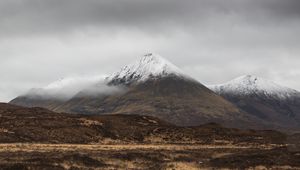 Preview wallpaper mountain, peak, fog, snowy, clouds