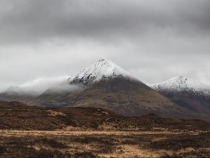 Preview wallpaper mountain, peak, fog, snowy, clouds