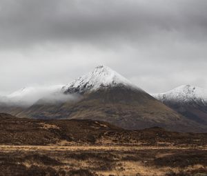Preview wallpaper mountain, peak, fog, snowy, clouds