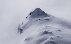 Preview wallpaper mountain, peak, fog, snow, snowy