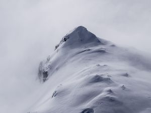 Preview wallpaper mountain, peak, fog, snow, snowy