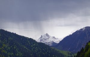 Preview wallpaper mountain, peak, forest, rain, landscape