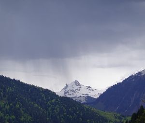Preview wallpaper mountain, peak, forest, rain, landscape