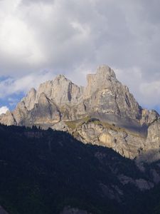 Preview wallpaper mountain, peak, forest, clouds, nature, landscape