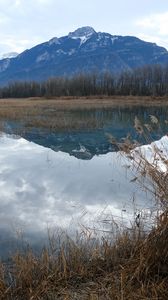 Preview wallpaper mountain, peak, lake, grass, nature