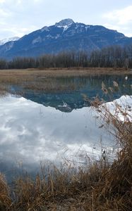 Preview wallpaper mountain, peak, lake, grass, nature