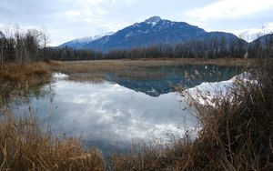 Preview wallpaper mountain, peak, lake, grass, nature