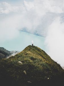 Preview wallpaper mountain, peak, loneliness, clouds, solitude, lonely, man