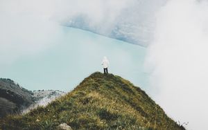 Preview wallpaper mountain, peak, loneliness, clouds, solitude, lonely, man