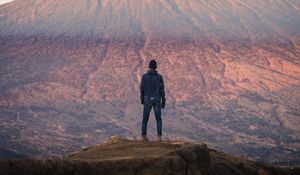 Preview wallpaper mountain, peak, man, loneliness, height