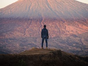 Preview wallpaper mountain, peak, man, loneliness, height