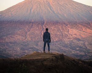 Preview wallpaper mountain, peak, man, loneliness, height