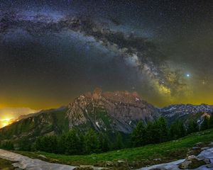 Preview wallpaper mountain, peak, milky way, road, night