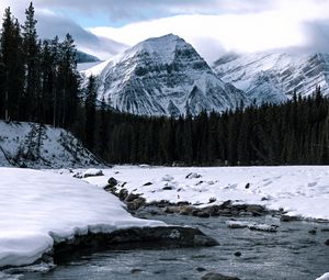 Preview wallpaper mountain, peak, river, forest, snow, snowy