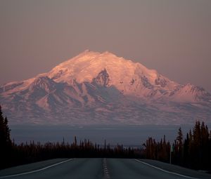 Preview wallpaper mountain, peak, road, forest, twilight