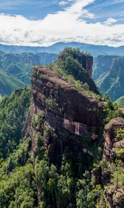 Preview wallpaper mountain, peak, rock, trees, clouds, landscape