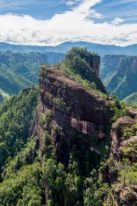 Preview wallpaper mountain, peak, rock, trees, clouds, landscape