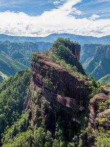 Preview wallpaper mountain, peak, rock, trees, clouds, landscape