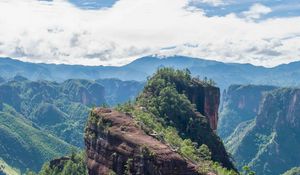 Preview wallpaper mountain, peak, rock, trees, clouds, landscape