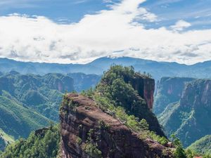 Preview wallpaper mountain, peak, rock, trees, clouds, landscape