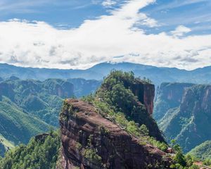 Preview wallpaper mountain, peak, rock, trees, clouds, landscape