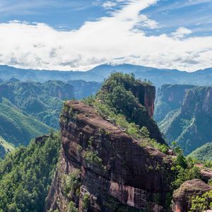 Preview wallpaper mountain, peak, rock, trees, clouds, landscape