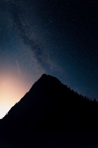 Preview wallpaper mountain, peak, silhouette, starfall, stars, night