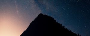 Preview wallpaper mountain, peak, silhouette, starfall, stars, night