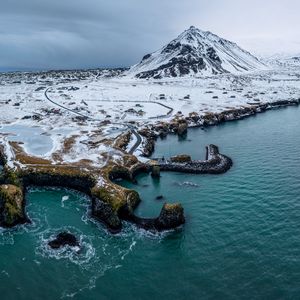 Preview wallpaper mountain, peak, snow, island, sea, nature