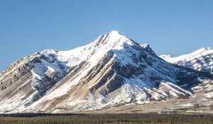 Preview wallpaper mountain, peak, snow, trees, forest, winter