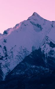 Preview wallpaper mountain, peak, snow, winter, sunset, sky, pink